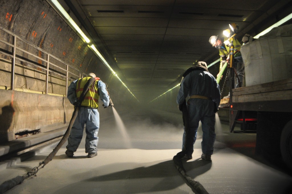 Crew spraying a tunnel lining